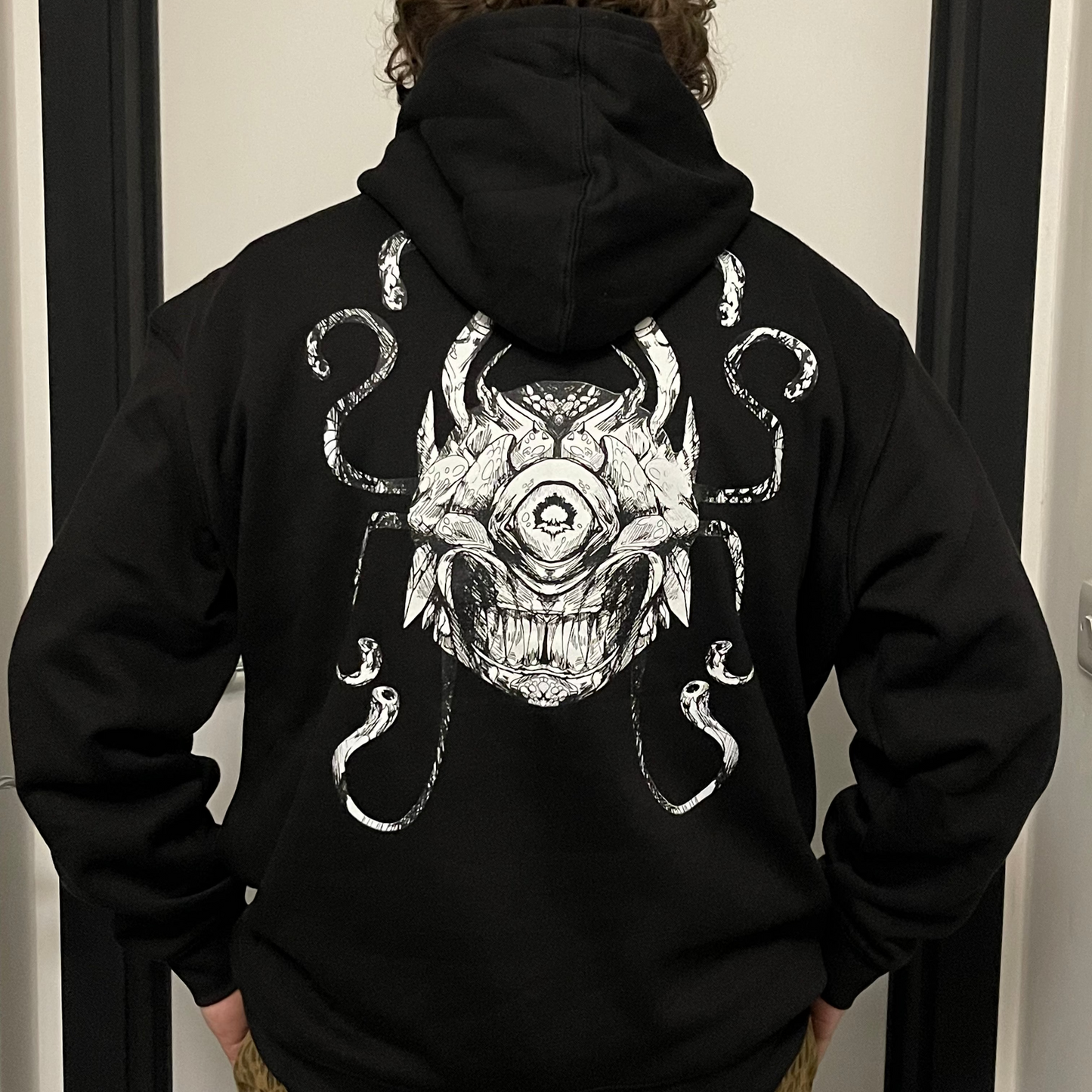 Eye of the Beholder pullover hoodie in black